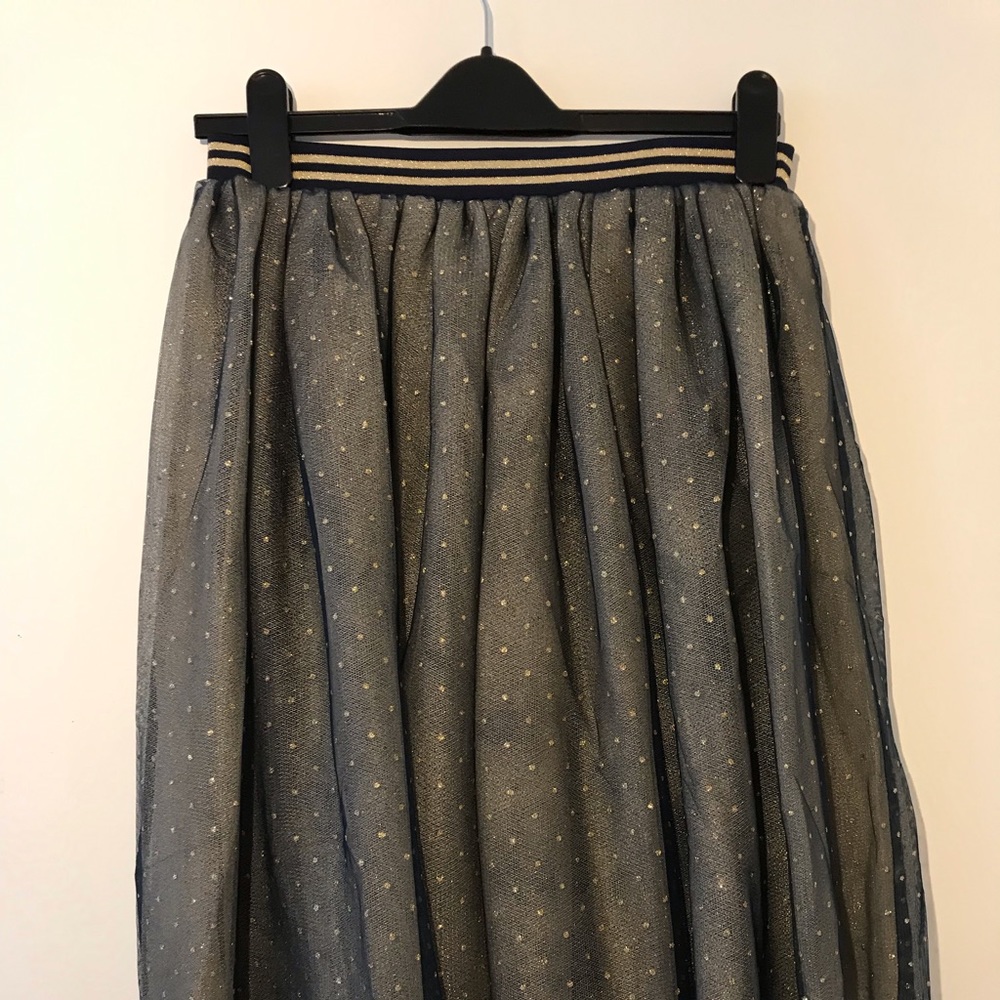 Navy blue polka dot skirt.